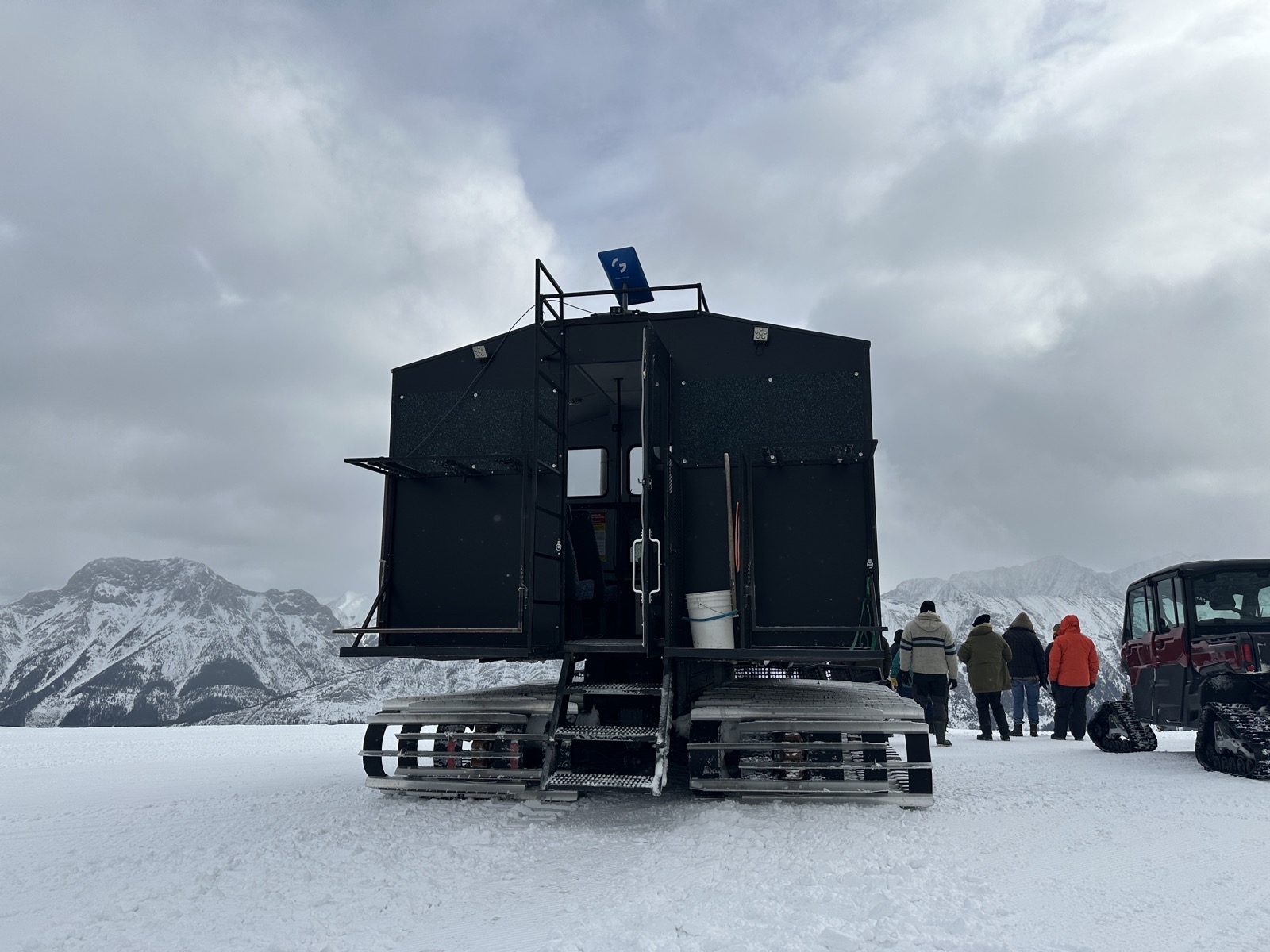 Genstate dish mounted on tracked SnowCAT vehicle in the Rocky Mountains
